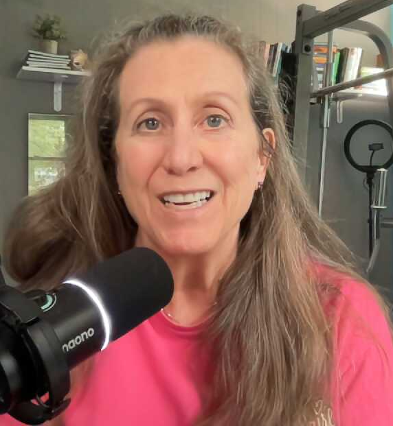 Woman smiling while recording a podcast